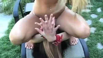 Sexy mistresse sits on man's face
